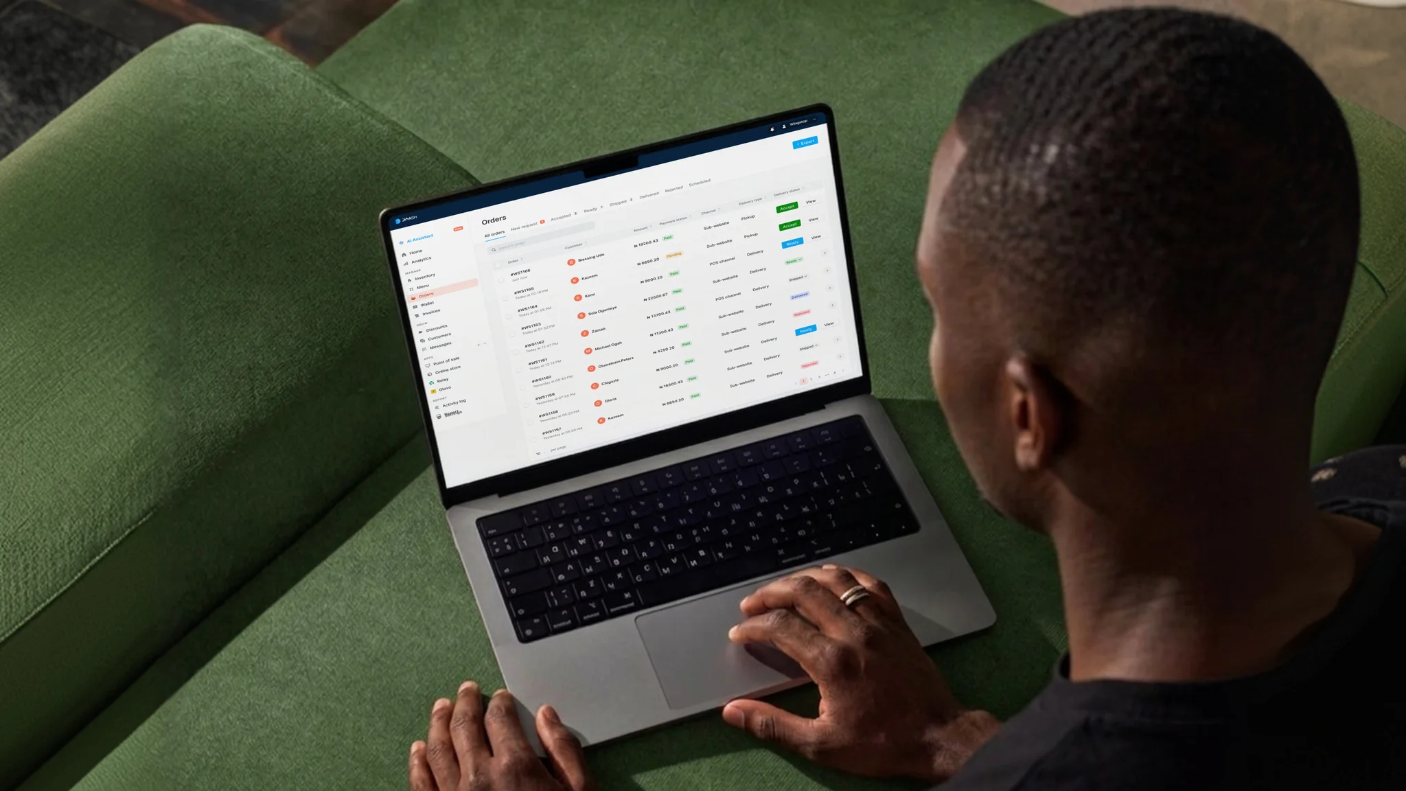 A store owner managing their Daash dashboard on a laptop